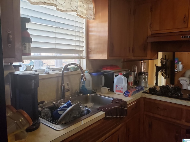 kitchen with black gas stovetop and sink