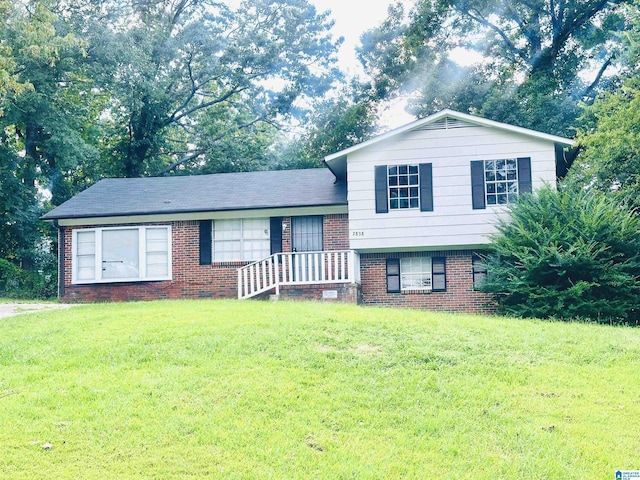 2838 Micmac Dr, Birmingham, AL 35215 - tri-level home featuring brick siding and a front yard