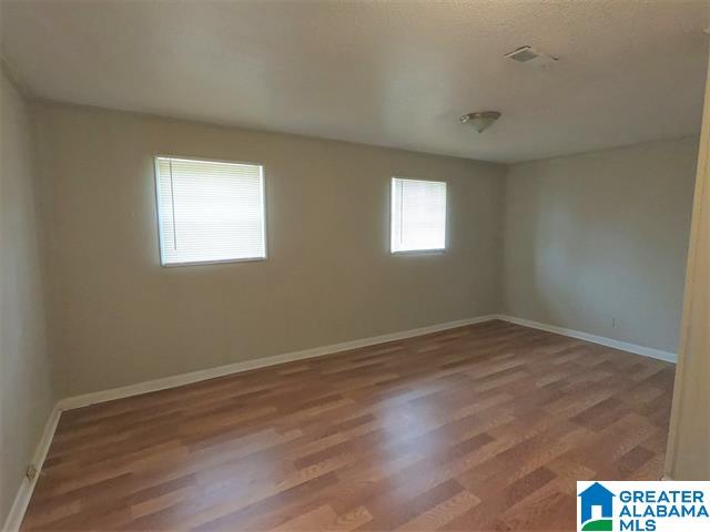 2838 Micmac Dr, Birmingham, AL 35215 - spare room with baseboards and wood finished floors