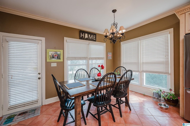 tiled dining area with an inviting chandelier and ornamental molding