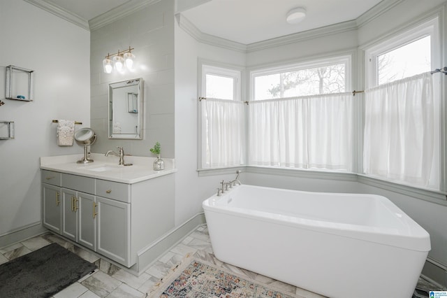 bathroom with crown molding, a bath, and vanity