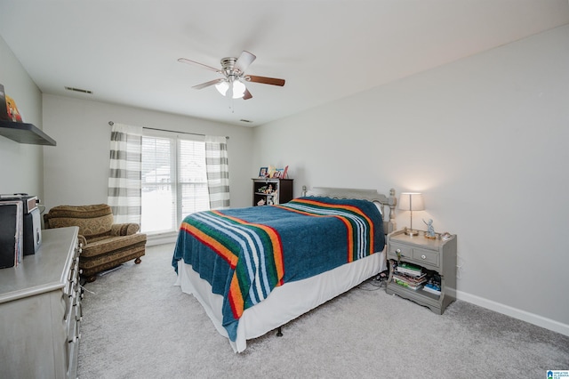 bedroom featuring light carpet and ceiling fan