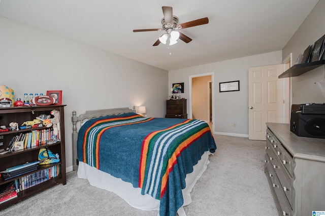 bedroom featuring light carpet and ceiling fan