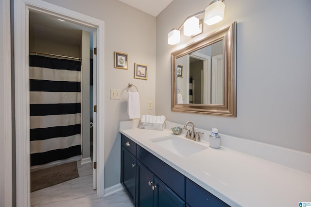 bathroom with vanity and walk in shower