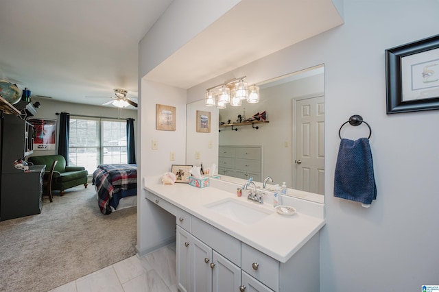 bathroom featuring ceiling fan and vanity