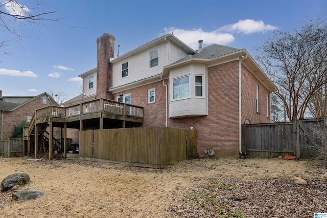 back of house featuring a deck