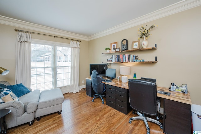 home office with ornamental molding and light wood-type flooring