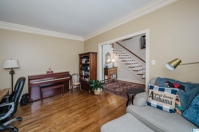 interior space with wood-type flooring and crown molding