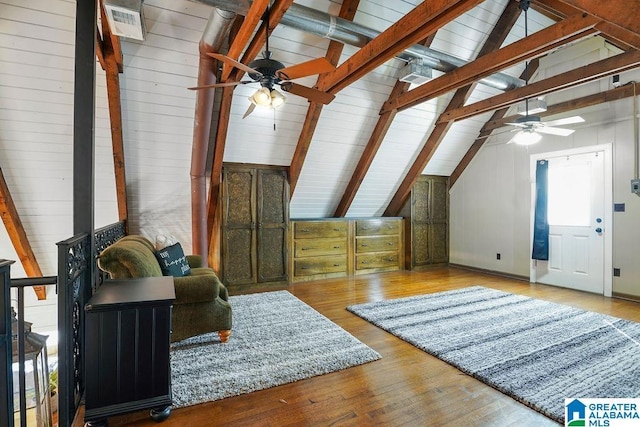 additional living space featuring lofted ceiling with beams, ceiling fan, and light hardwood / wood-style floors