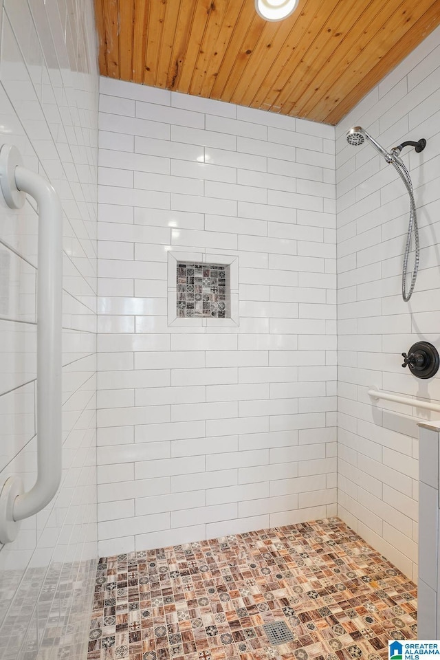 bathroom with wooden ceiling and tiled shower