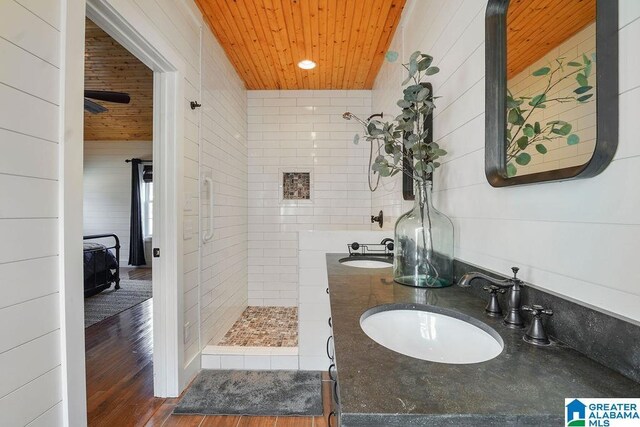 bathroom with vanity, hardwood / wood-style floors, and wooden ceiling