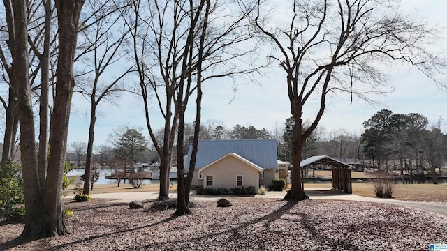 view of side of home featuring a water view