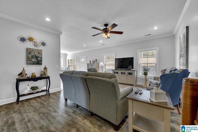 living area featuring ornamental molding, recessed lighting, wood finished floors, and baseboards