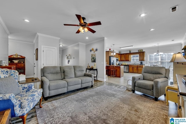 living room featuring light wood-type flooring, visible vents, and recessed lighting