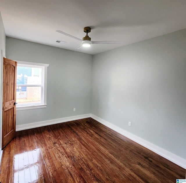 unfurnished room with dark wood-type flooring and ceiling fan