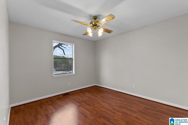 spare room with hardwood / wood-style flooring, a textured ceiling, and ceiling fan