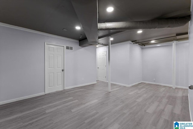 basement featuring light hardwood / wood-style floors