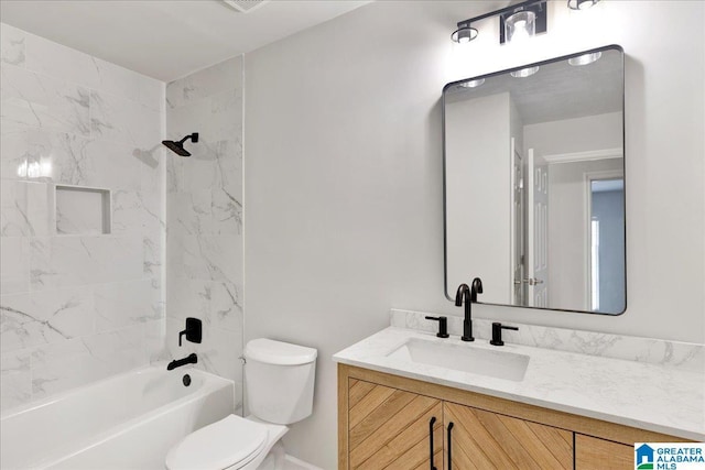 full bathroom featuring vanity, toilet, and tiled shower / bath combo