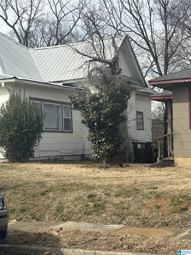 view of home's exterior featuring a yard