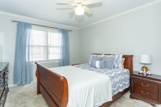 bedroom with crown molding, light colored carpet, and ceiling fan