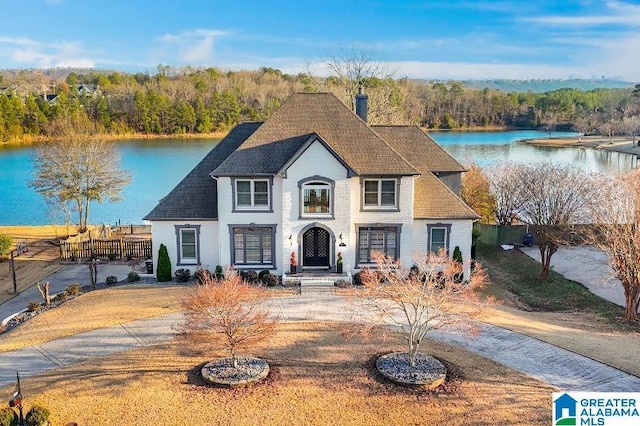 view of front of home with a water view