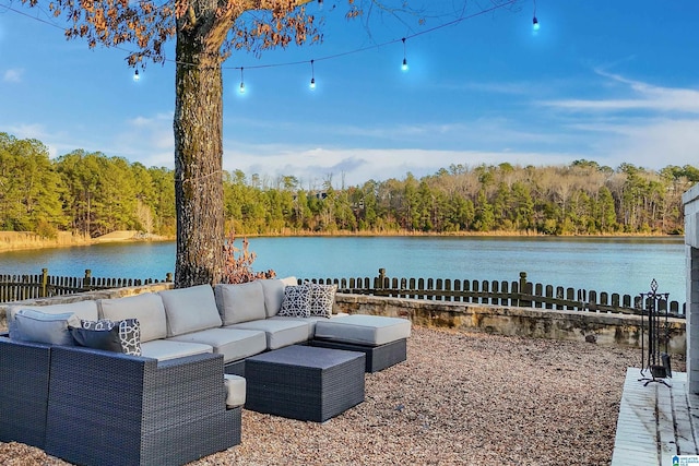 exterior space featuring an outdoor living space and a water view