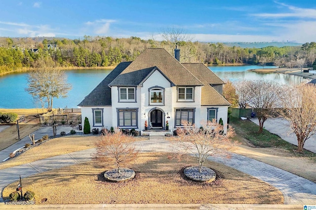 view of front of house with a water view