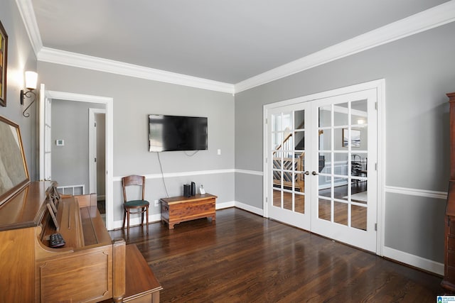 living area featuring dark wood-type flooring, ornamental molding, and french doors