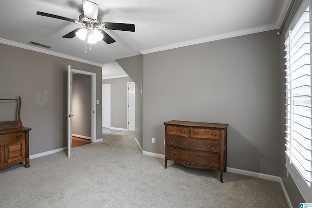 bedroom with light colored carpet, ornamental molding, and ceiling fan