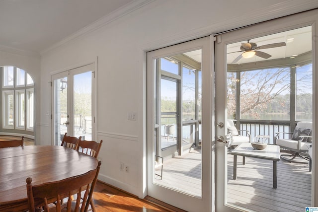 dining space featuring french doors, ceiling fan, ornamental molding, and hardwood / wood-style floors