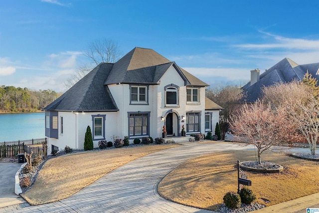 view of front of property with a water view