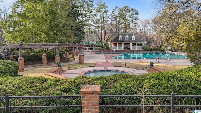 view of swimming pool with a patio, an outdoor structure, and a community hot tub