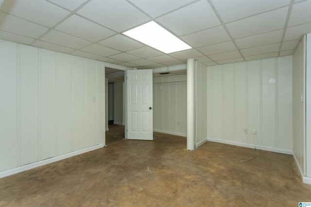 basement featuring a paneled ceiling