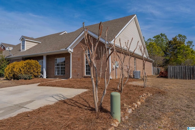 view of home's exterior with a patio area and central air condition unit