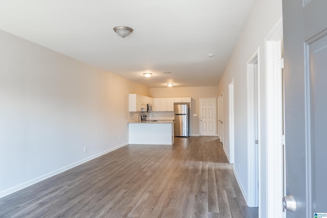 unfurnished living room with light wood-type flooring