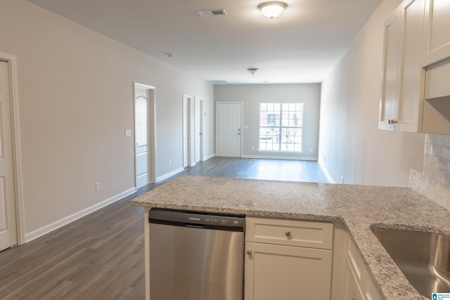 kitchen with white cabinetry, dishwasher, backsplash, dark hardwood / wood-style flooring, and light stone counters