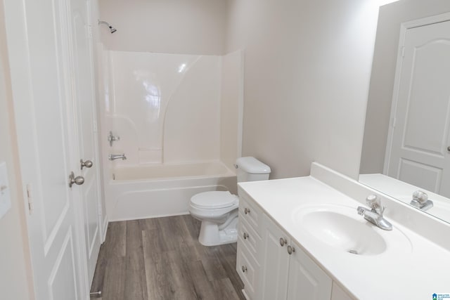 full bathroom with vanity, hardwood / wood-style floors, shower / tub combination, and toilet