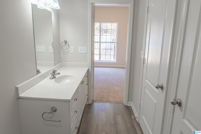 bathroom featuring vanity and hardwood / wood-style flooring