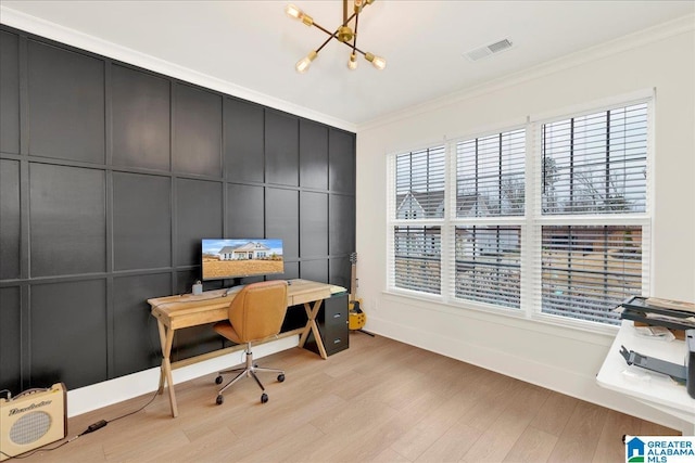 office area with ornamental molding, light hardwood / wood-style floors, and a chandelier