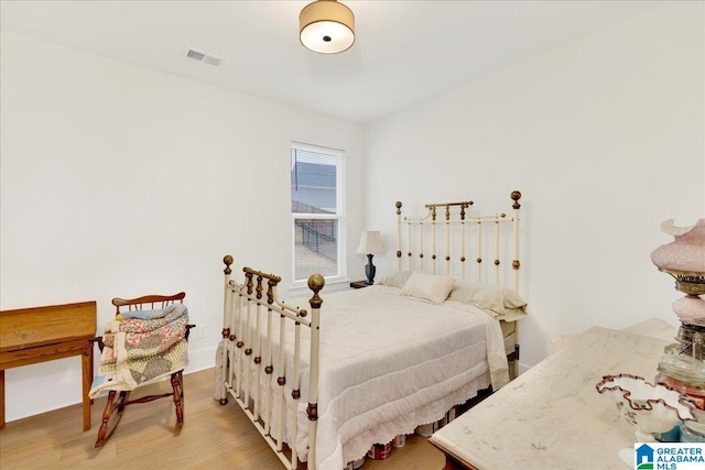 bedroom with light hardwood / wood-style flooring