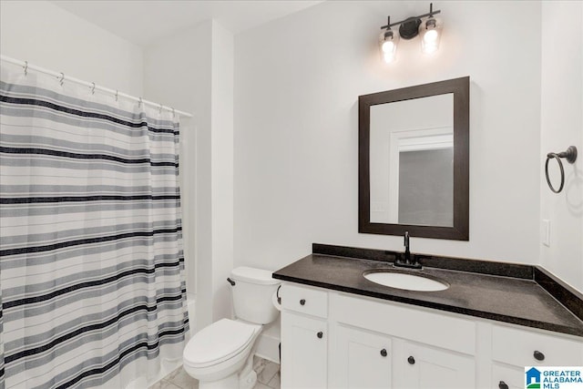 bathroom featuring vanity and toilet