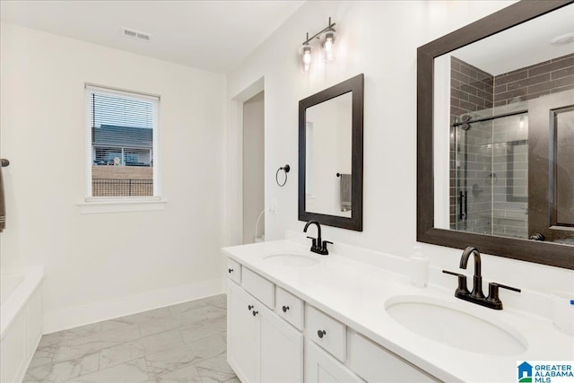 bathroom featuring vanity and a shower with door