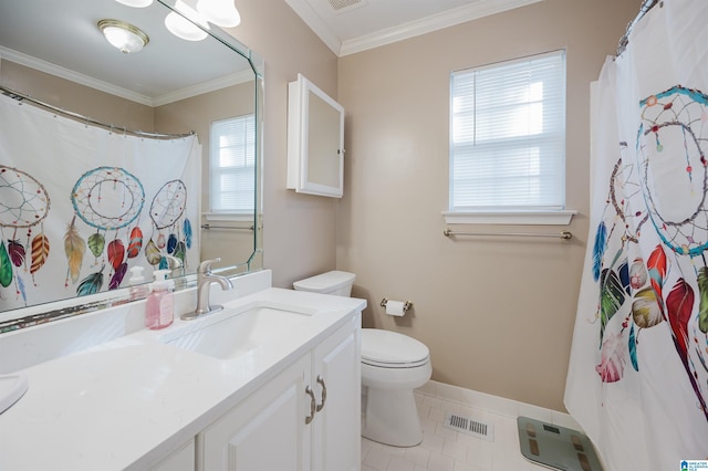 bathroom featuring tile patterned flooring, crown molding, vanity, and toilet