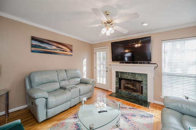 living room featuring crown molding and hardwood / wood-style floors