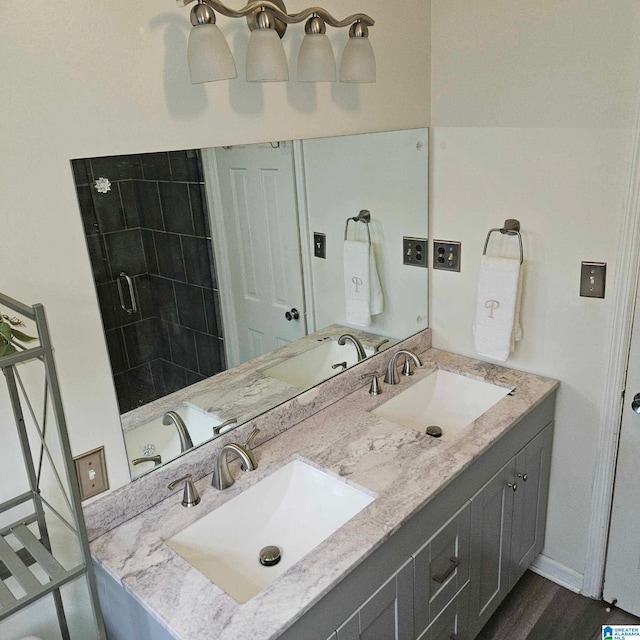 bathroom with vanity and hardwood / wood-style floors