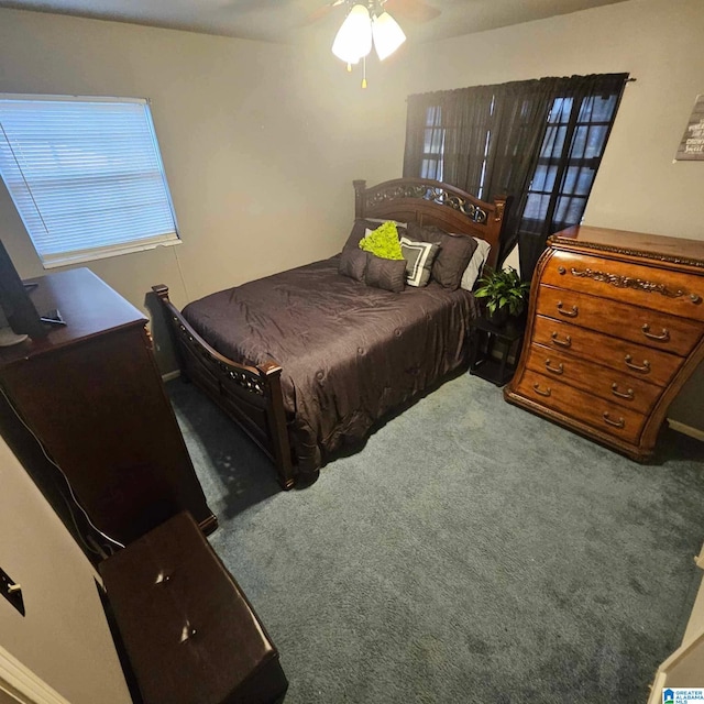 bedroom with ceiling fan and carpet flooring