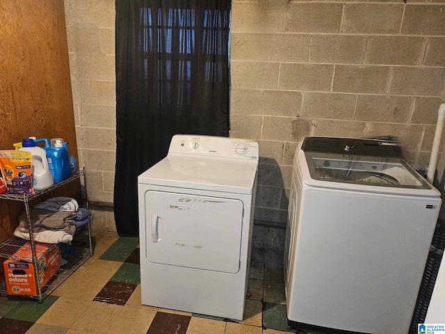 washroom featuring washing machine and dryer