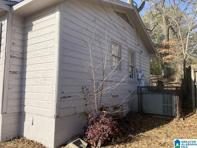 view of side of home featuring central air condition unit