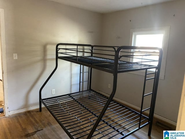 unfurnished bedroom with wood-type flooring