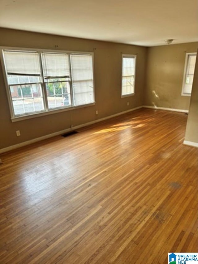 spare room featuring light hardwood / wood-style floors